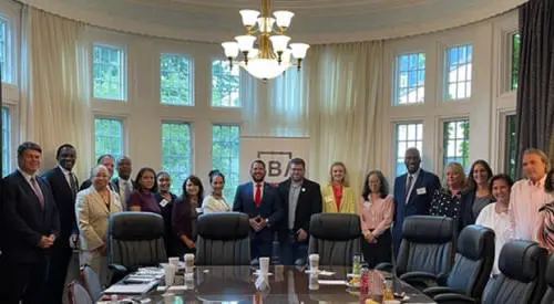 People gathered around a conference table.